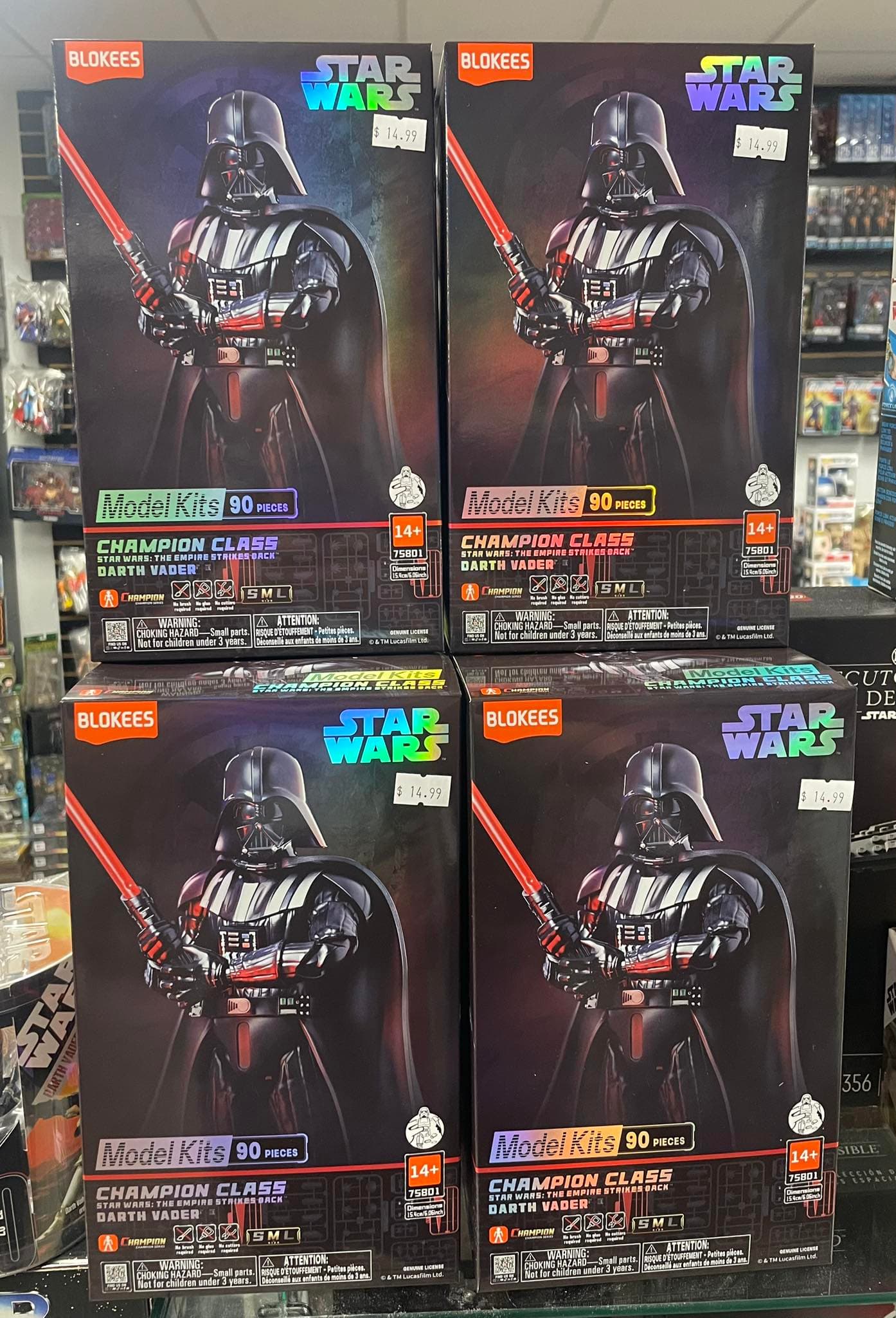 Four stacked boxes of Blokees Star Wars Darth Vader model kits priced at $14.99.